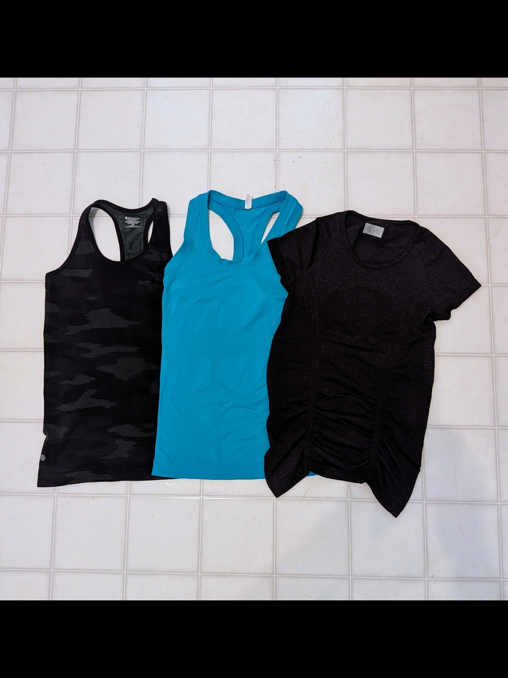 XS Athleta Black Camo Tank,  Blue Racerback Tank, and Black Ruched Tee